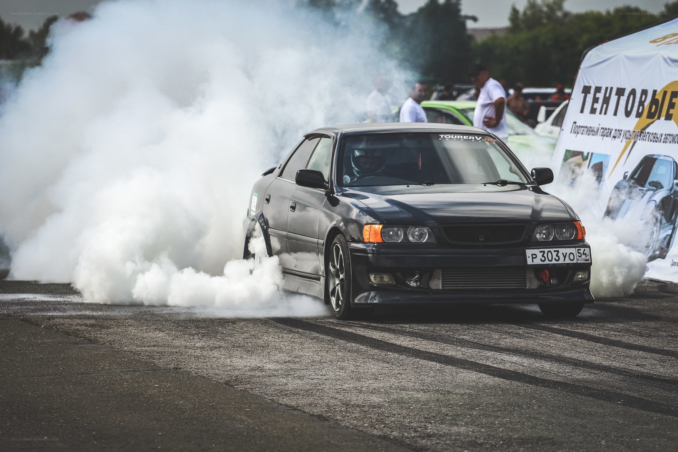 Black car drifting on track