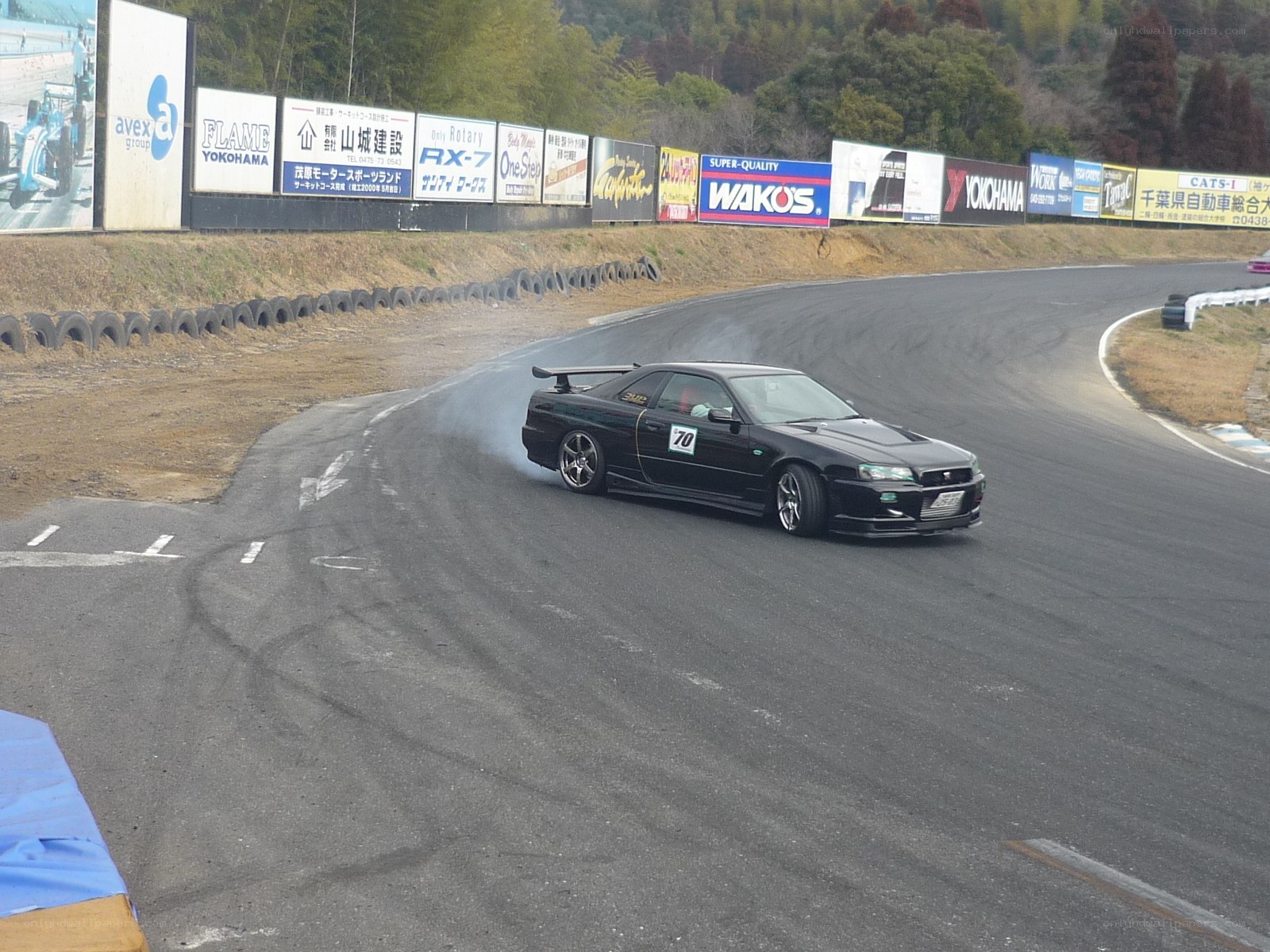 Black car drifting on track