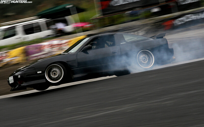 Black car drifting on track