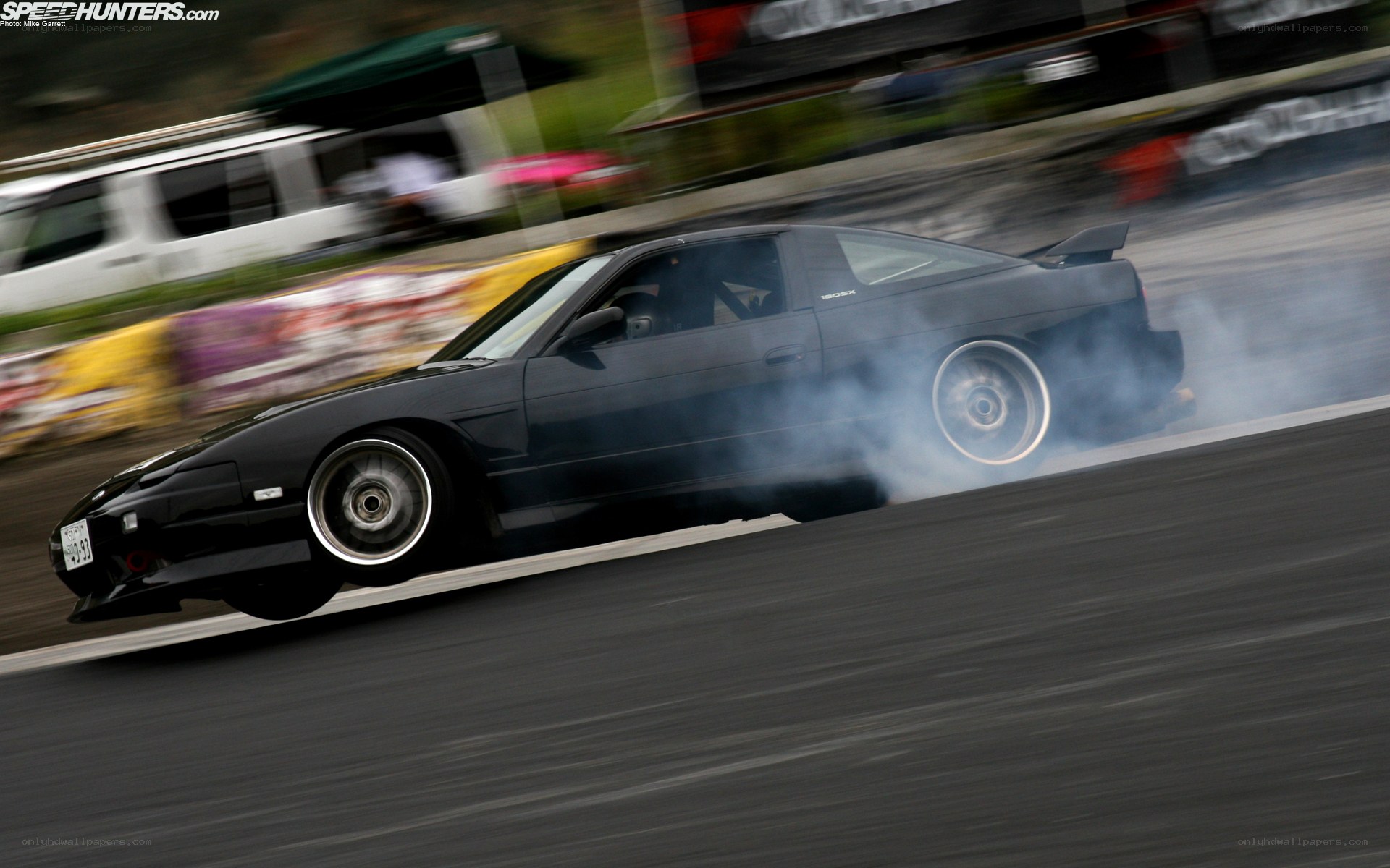Black car drifting on track