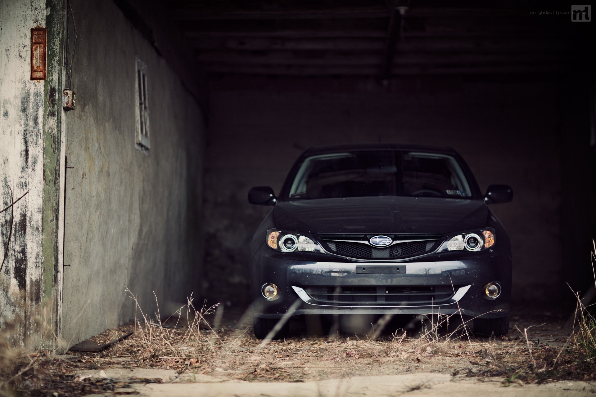Black car in a dark garage