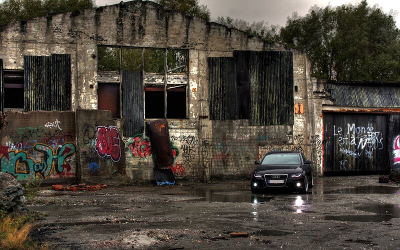 Black car in abandoned building