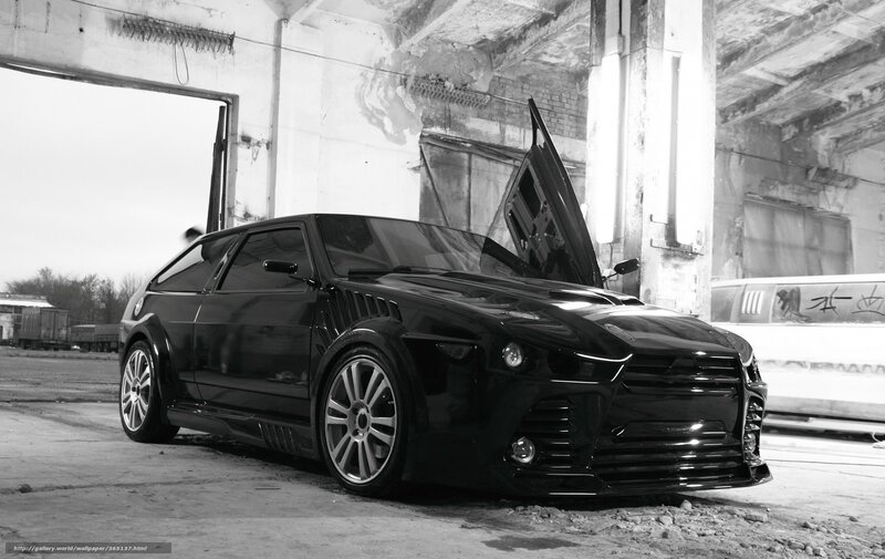 black car in abandoned garage