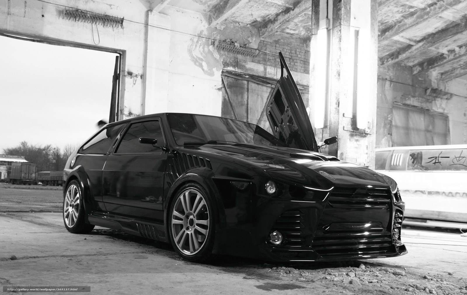 black car in abandoned garage