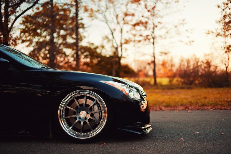 Black car in autumn scenery