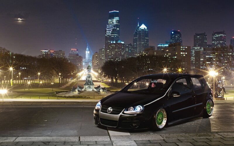 Black car in city at night