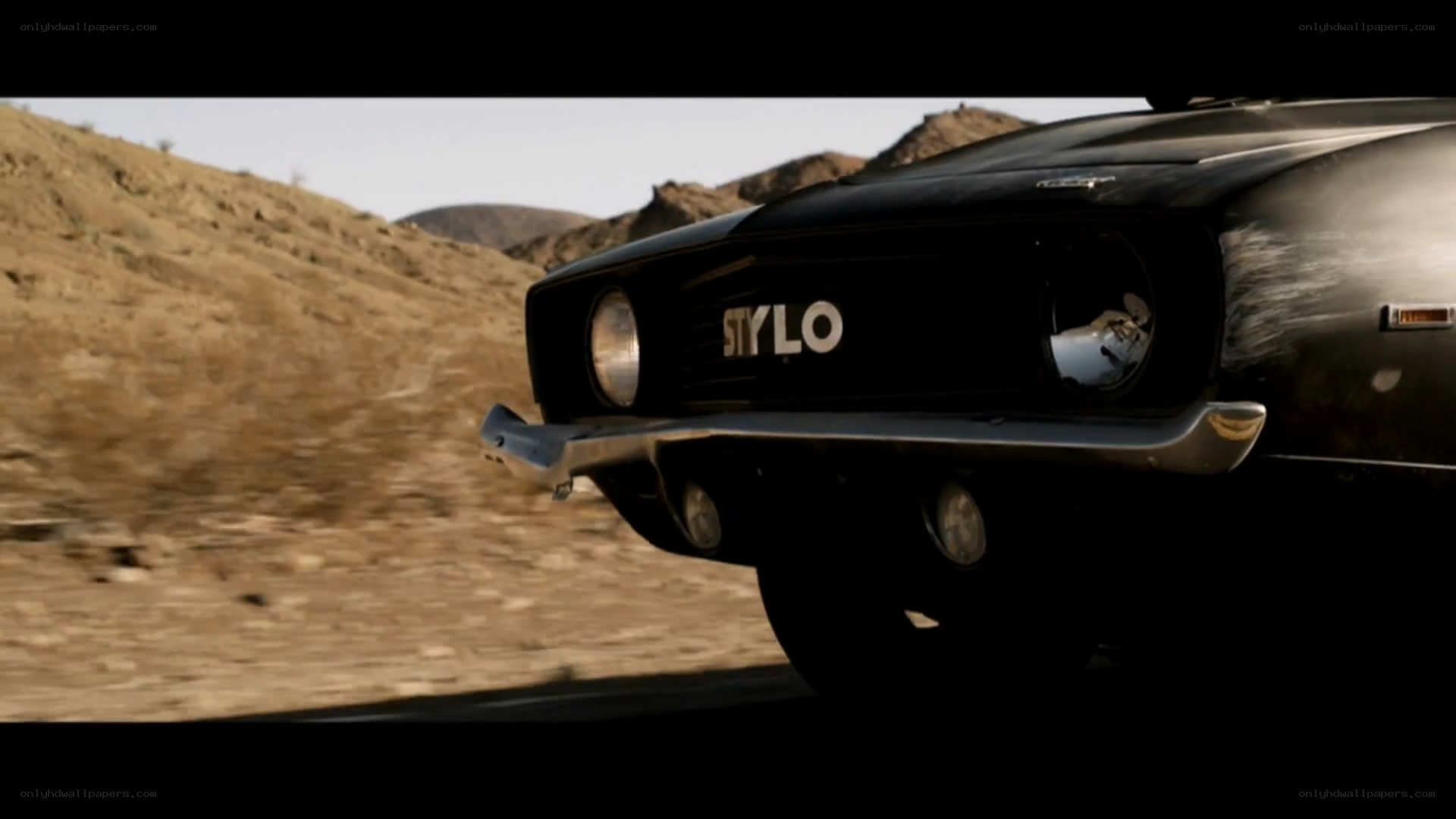 black car in desert landscape