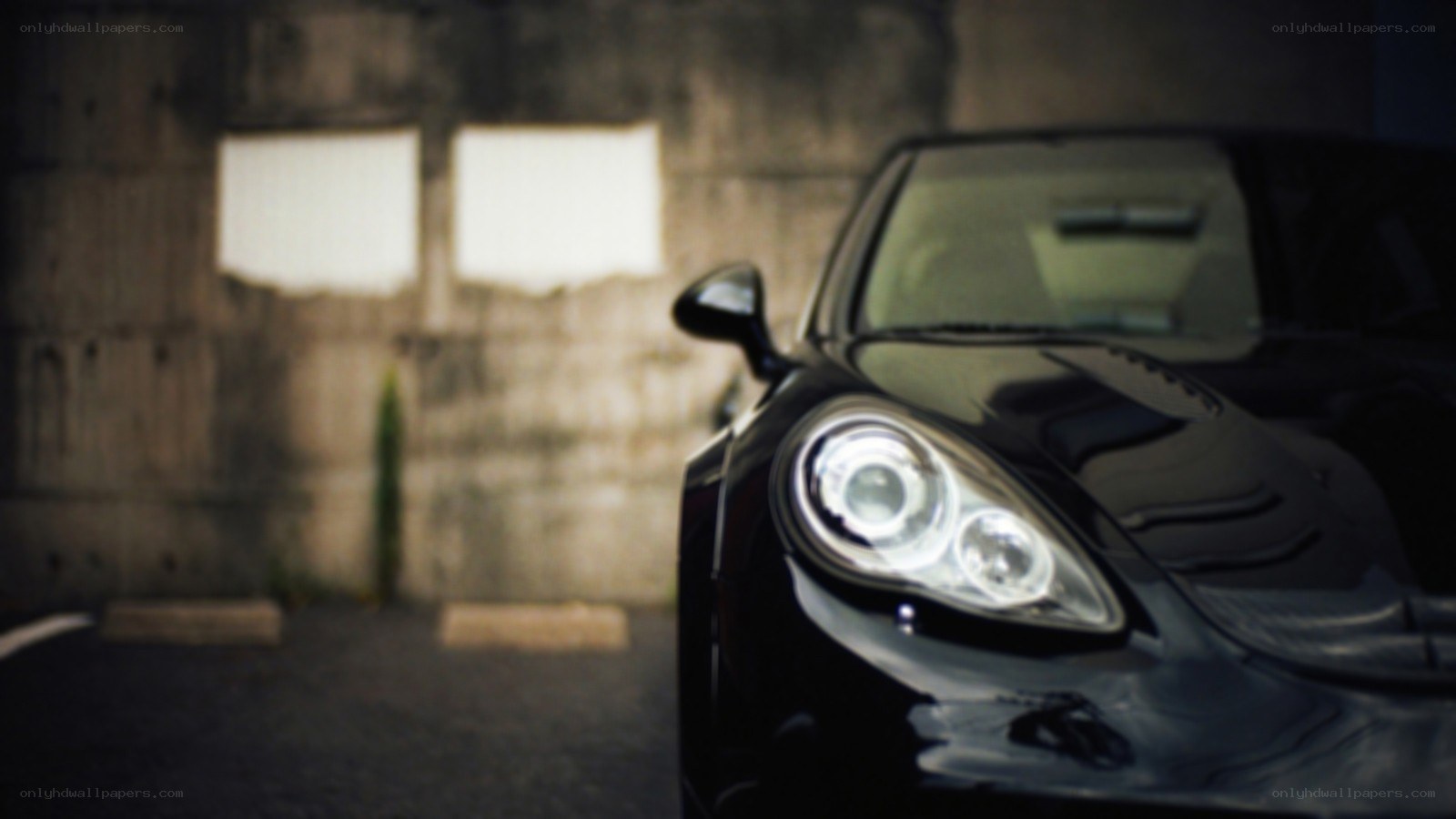 black car in dimly lit garage