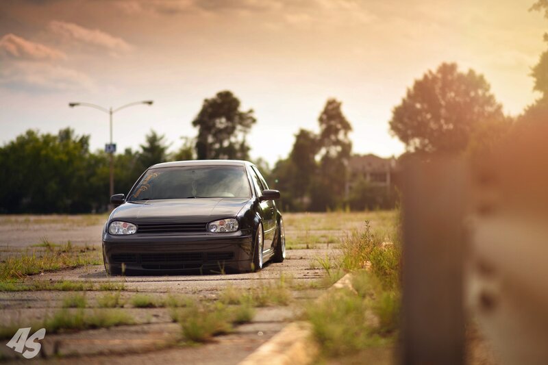 black car in empty lot