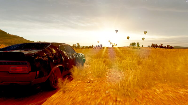 Black Car in Field — Yellow