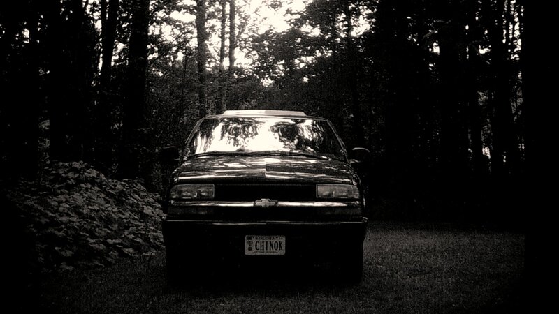 Black Car in Forest — Dark