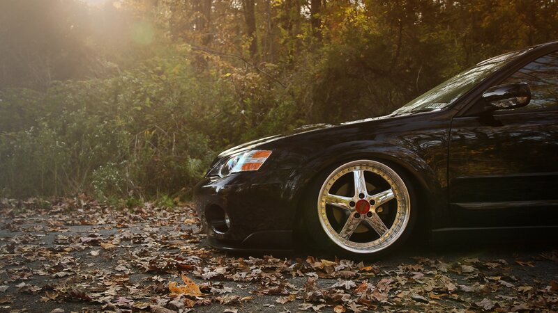 Black Car in Forest — Dramatic