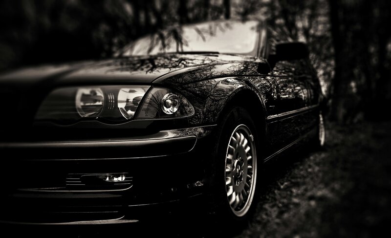 black car in forest