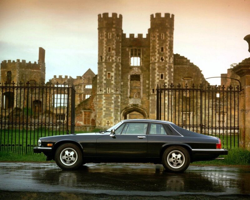 Black car in front of castle