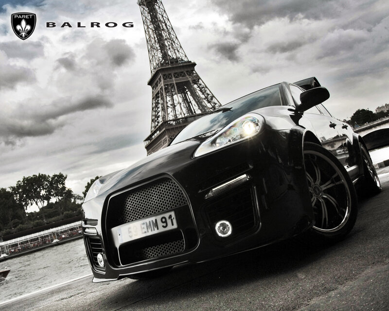 Black car in front of Eiffel Tower