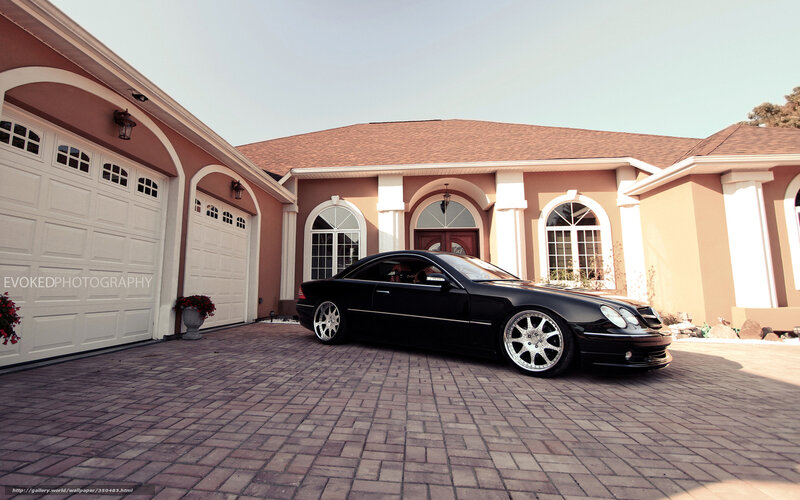 Black car in front of house