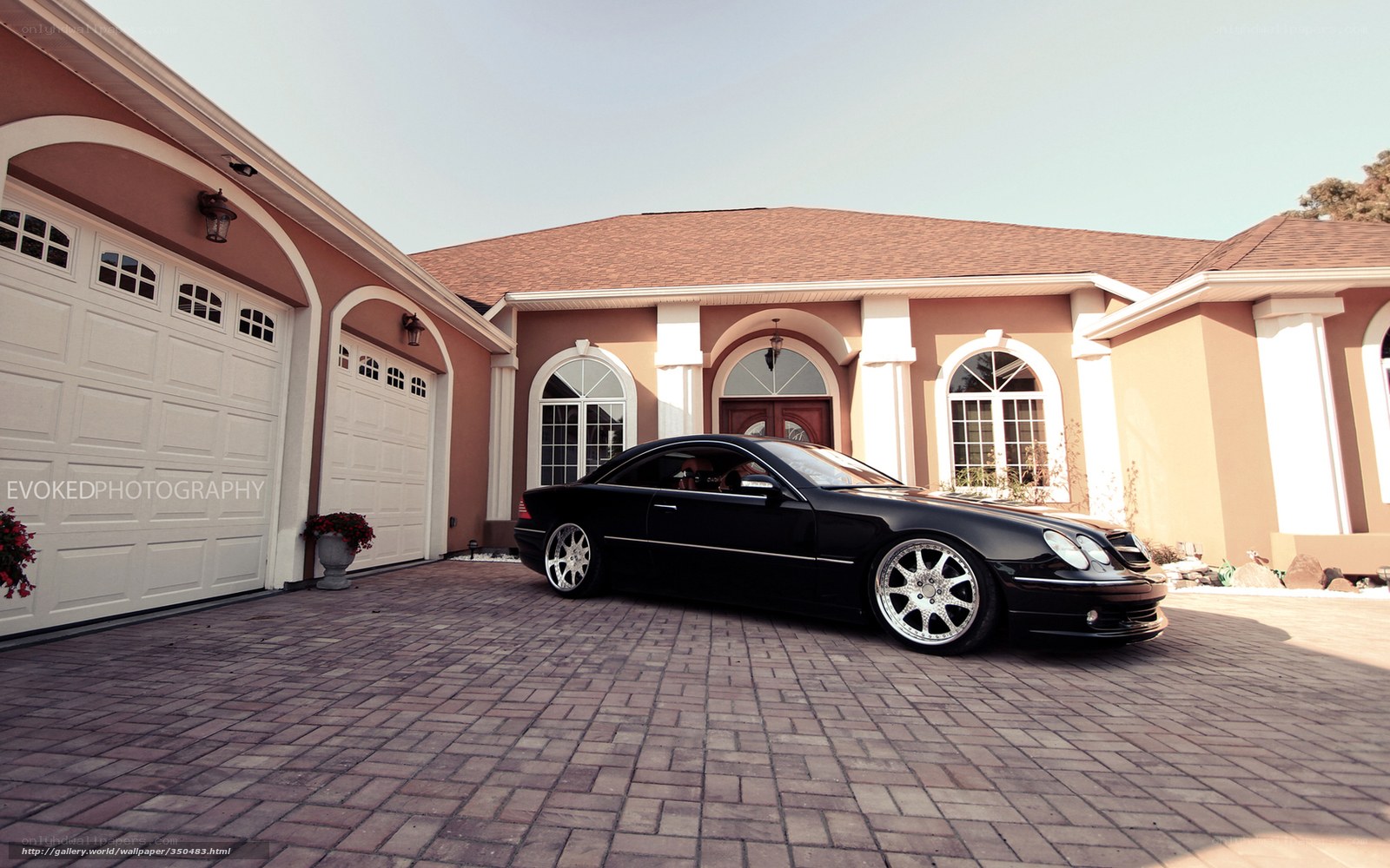 Black car in front of house