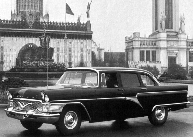 Black car in front of Soviet building
