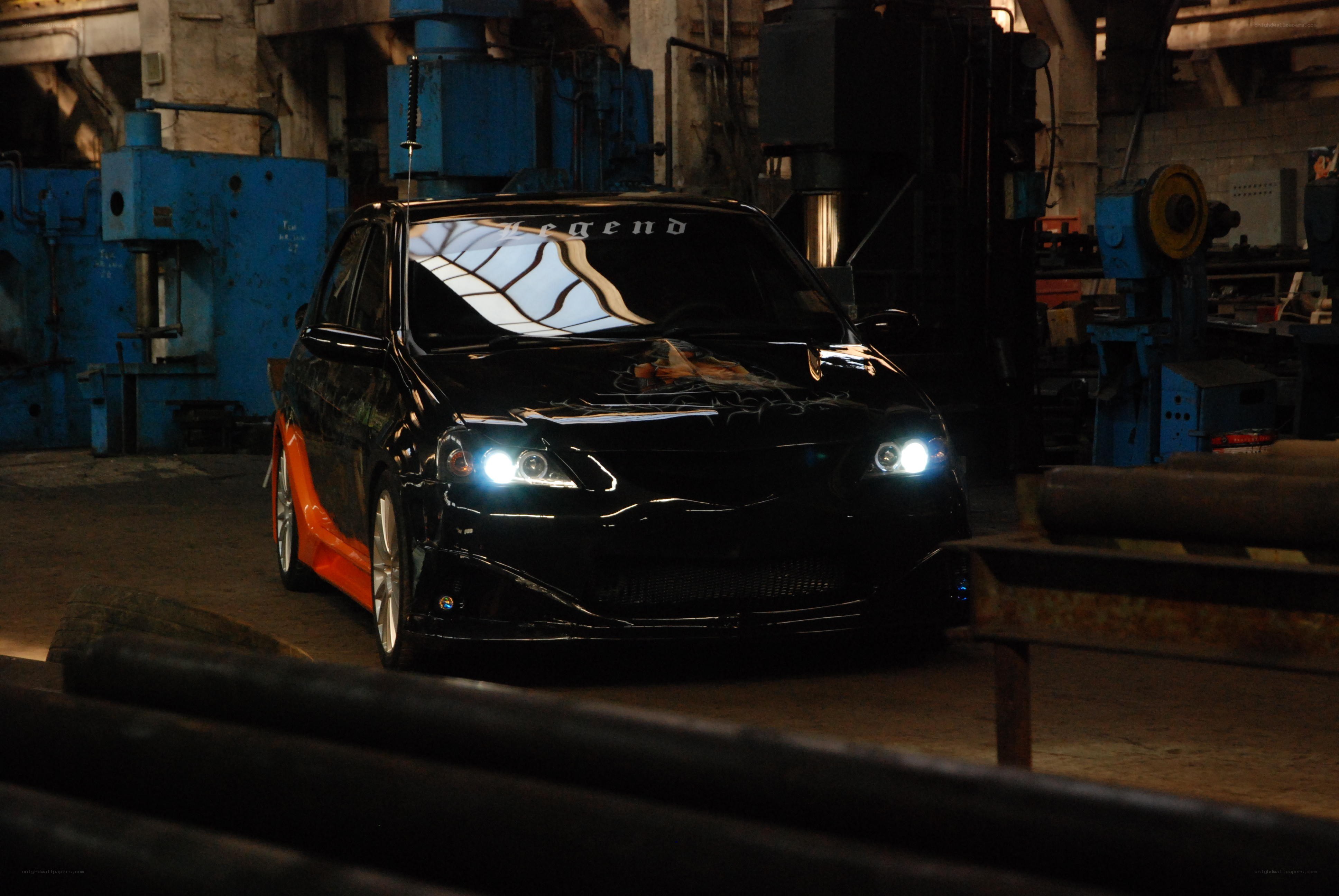 Black car in industrial setting
