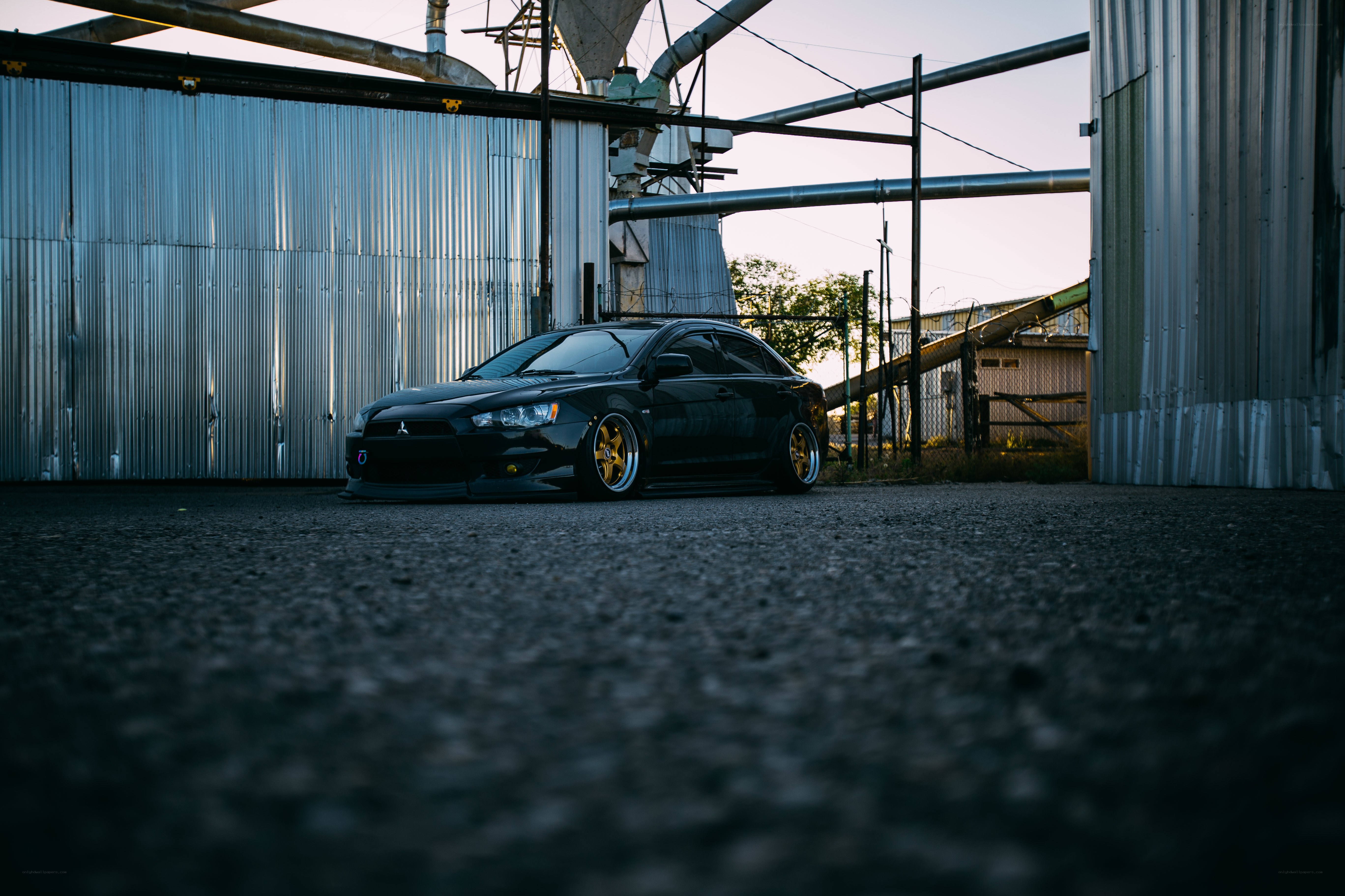 Black car in industrial setting