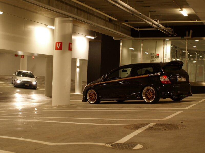 Black car in parking garage