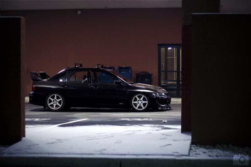 black car in parking garage