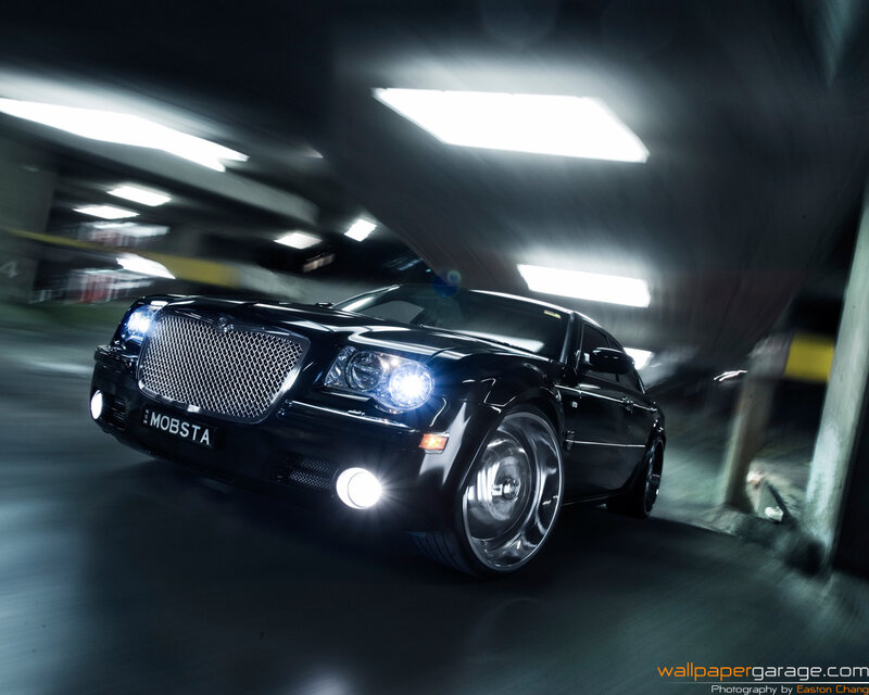 Black car in parking garage
