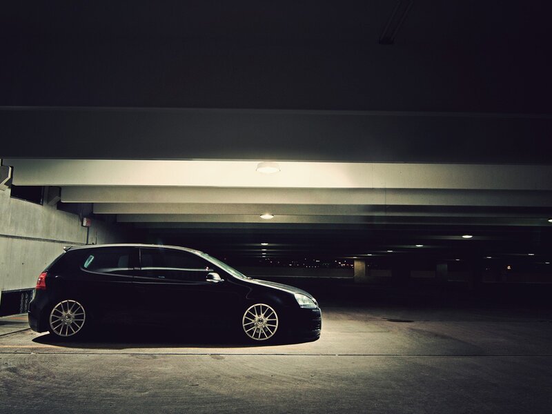 Black car in parking garage