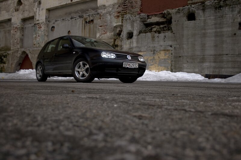 Black car in snowy alley