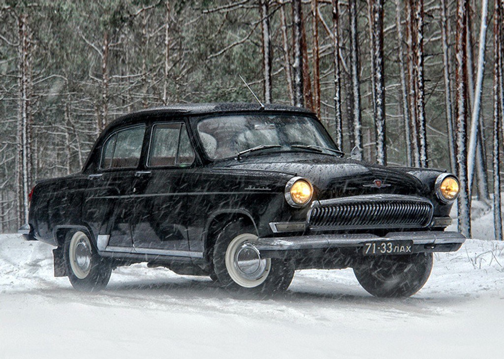 Black car in snowy forest