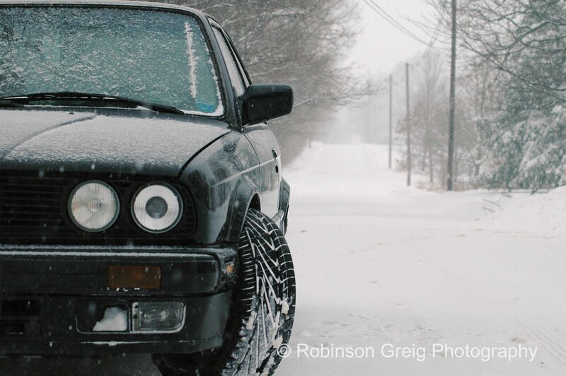 Black car in snowy landscape