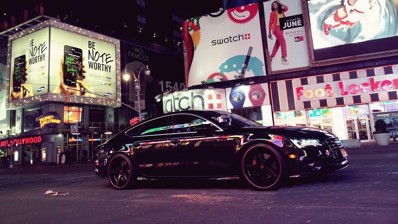 Black car in Times Square at night