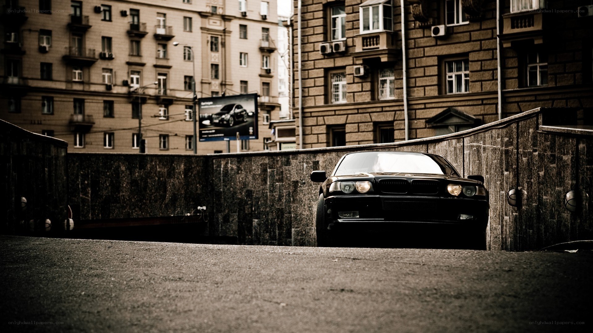 Black car in urban tunnel