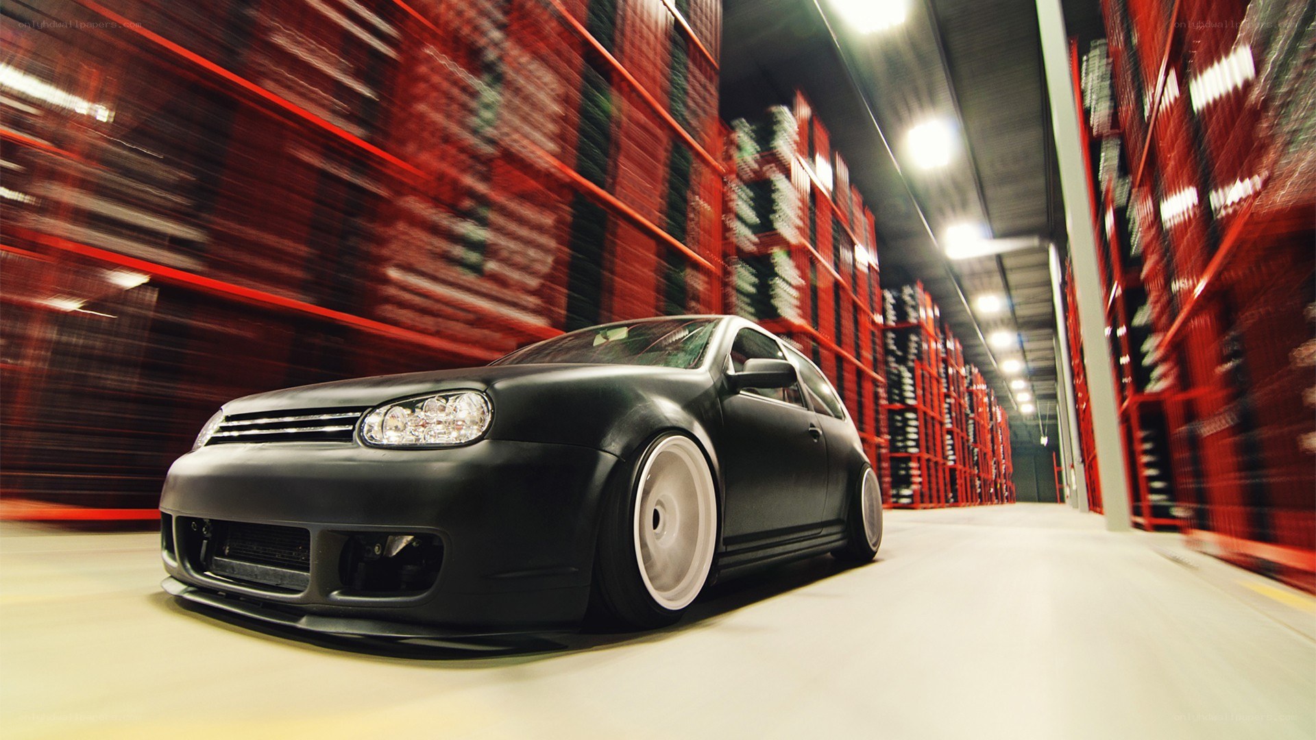 Black car in warehouse