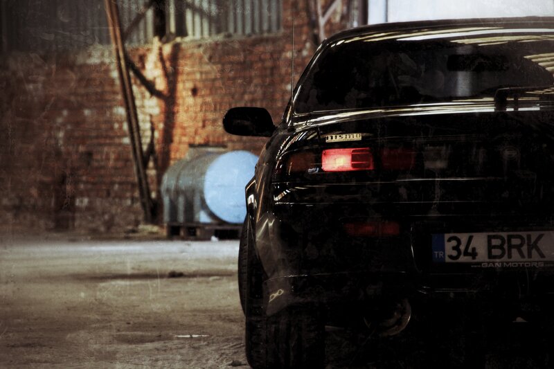 Black Car in Warehouse — Dramatic