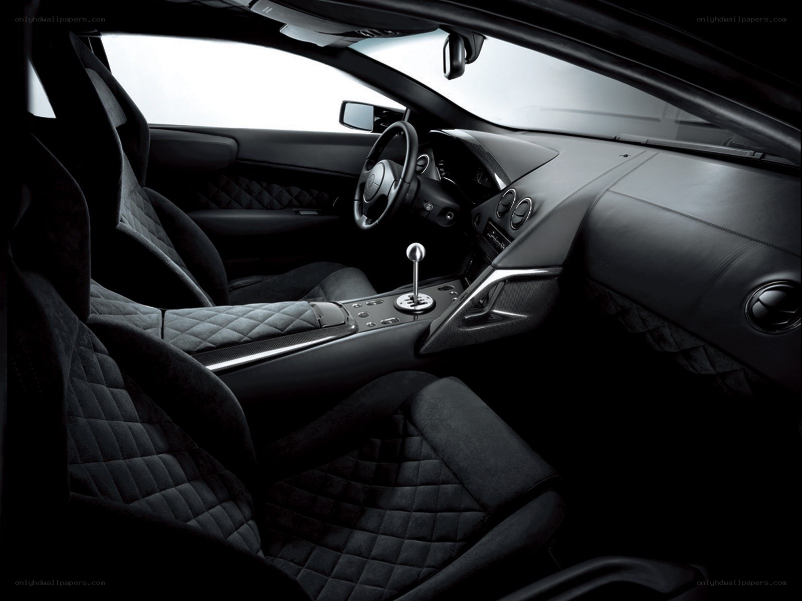 Black car interior with quilted seats