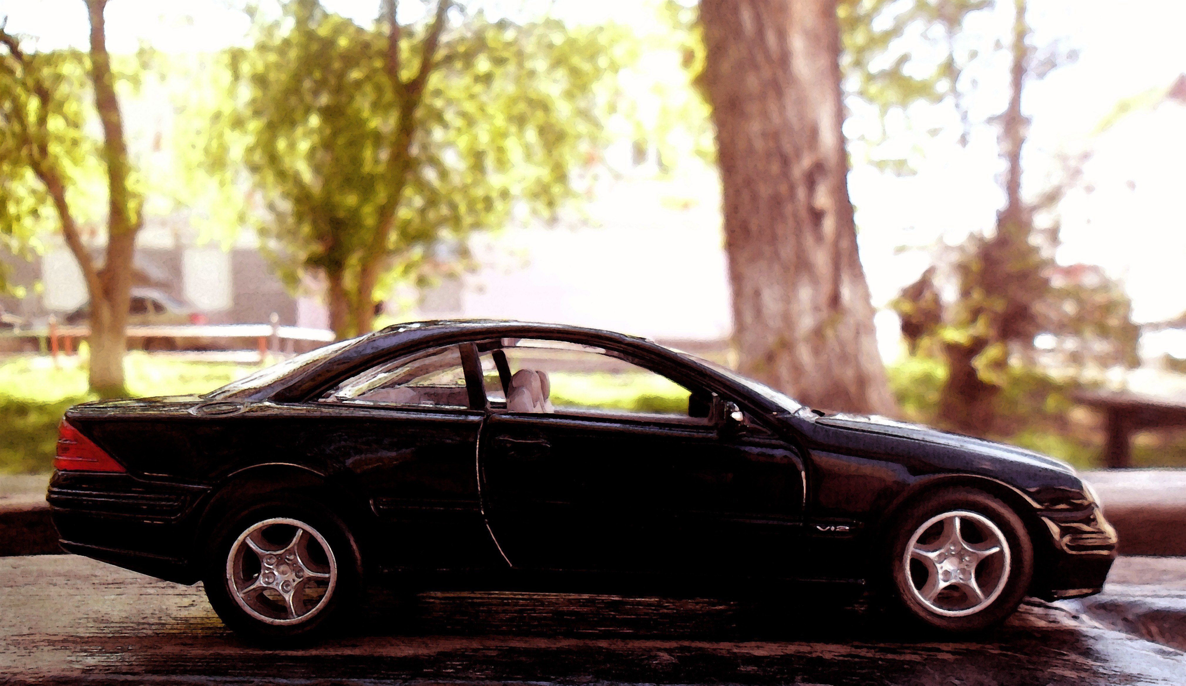 black car model on wooden surface