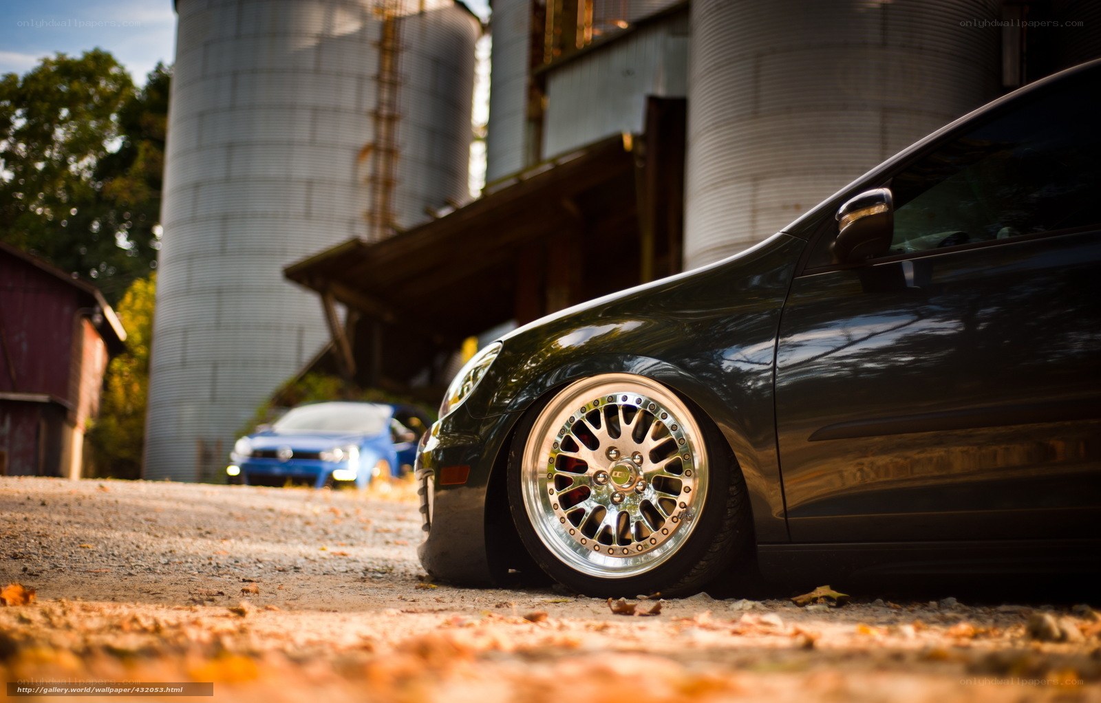 Black car near silos