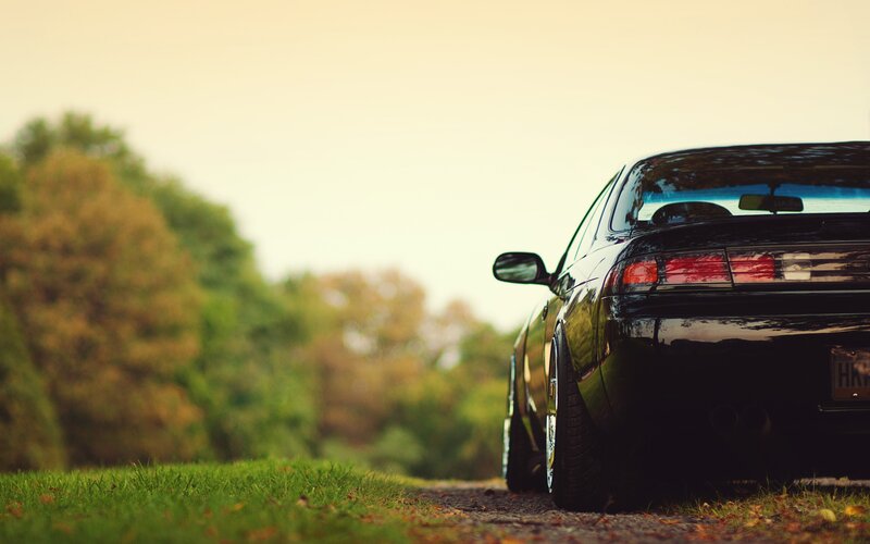 black car on a country road