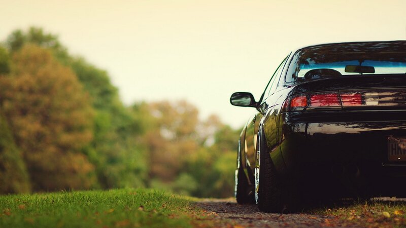 black car on a country road