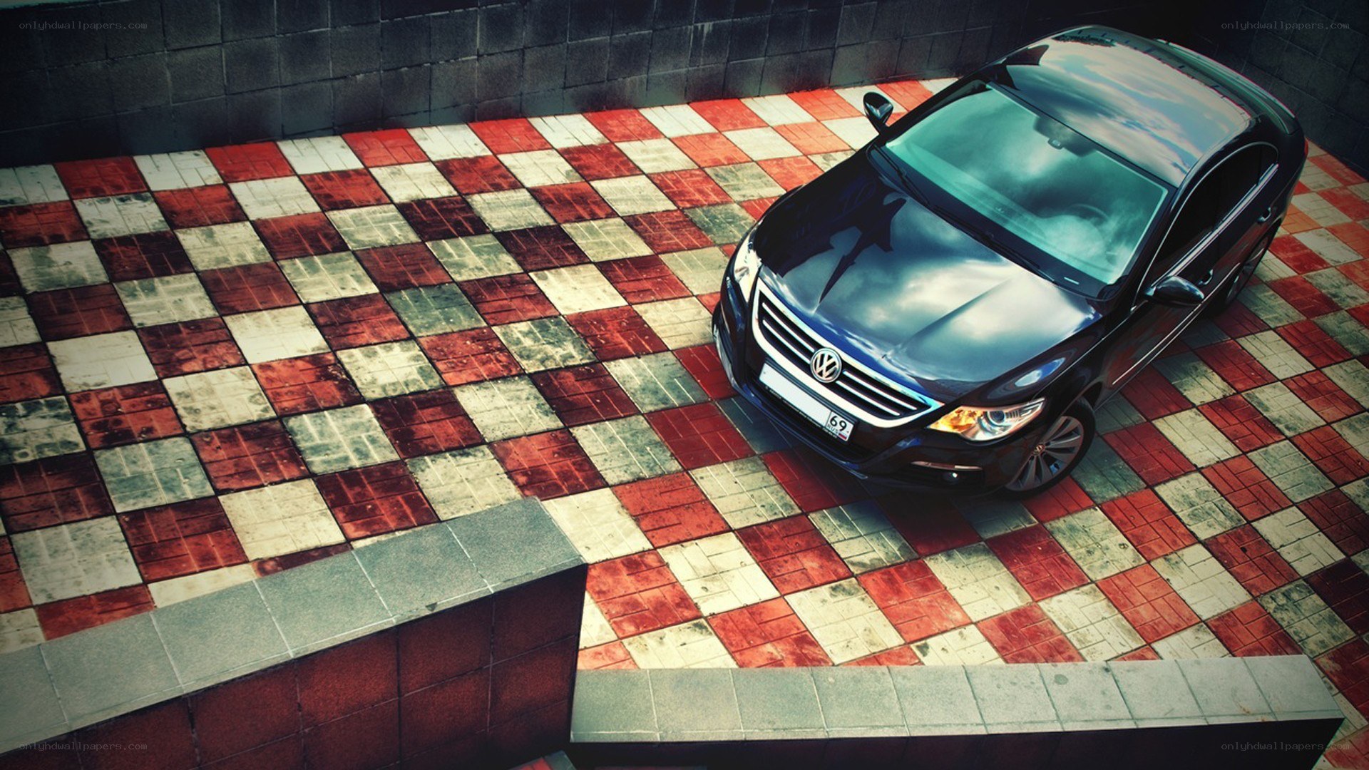 Black car on checkered floor