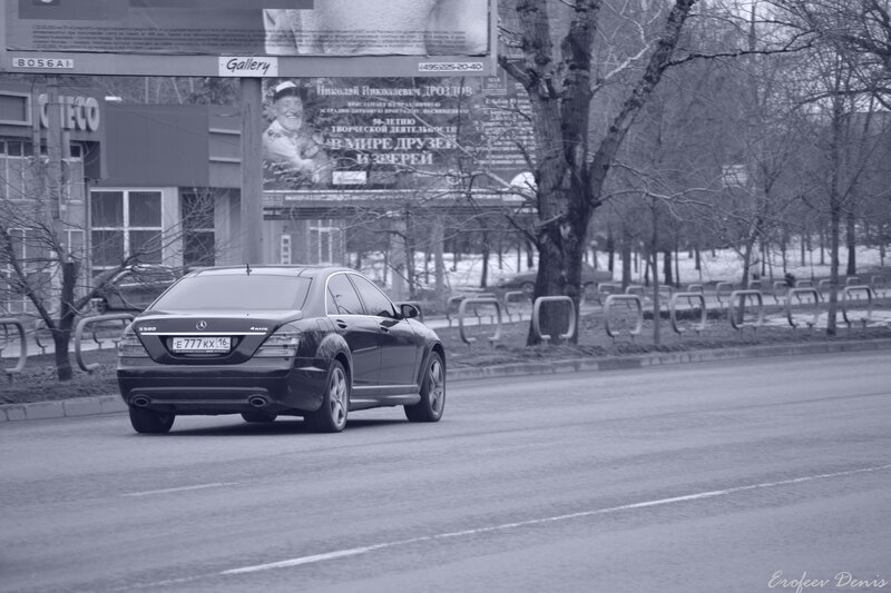 Black car on city street