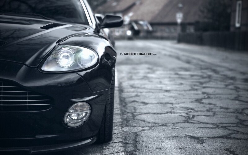 black car on cobblestone street