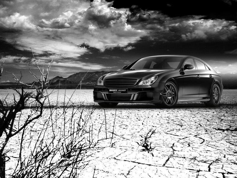Black Car on Cracked Ground — Dramatic