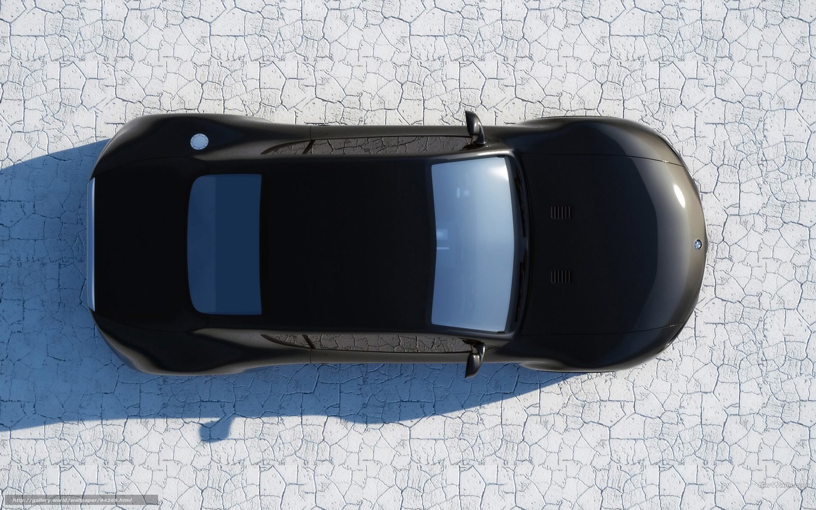 black car on cracked ground