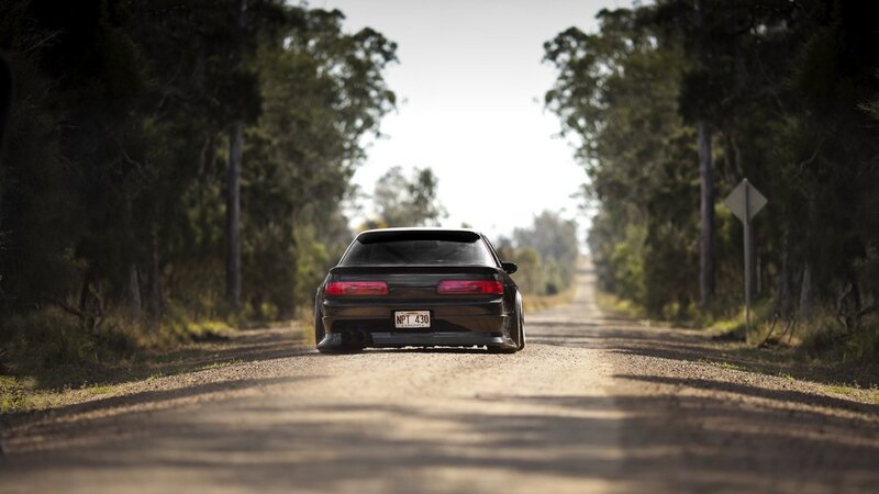 Black Car on Dirt Road — Brown