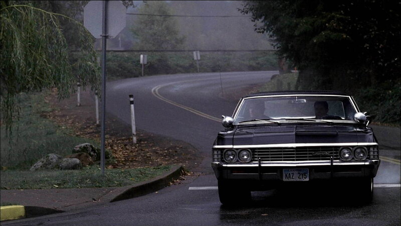 black car on foggy road
