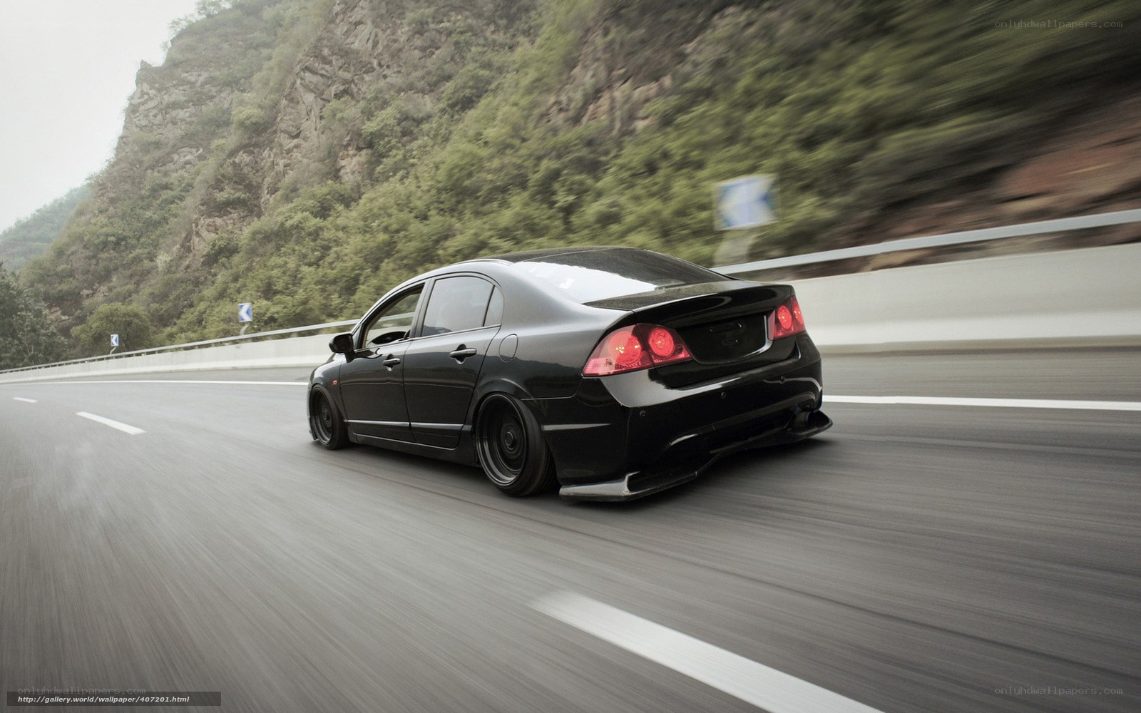 black car on mountain road