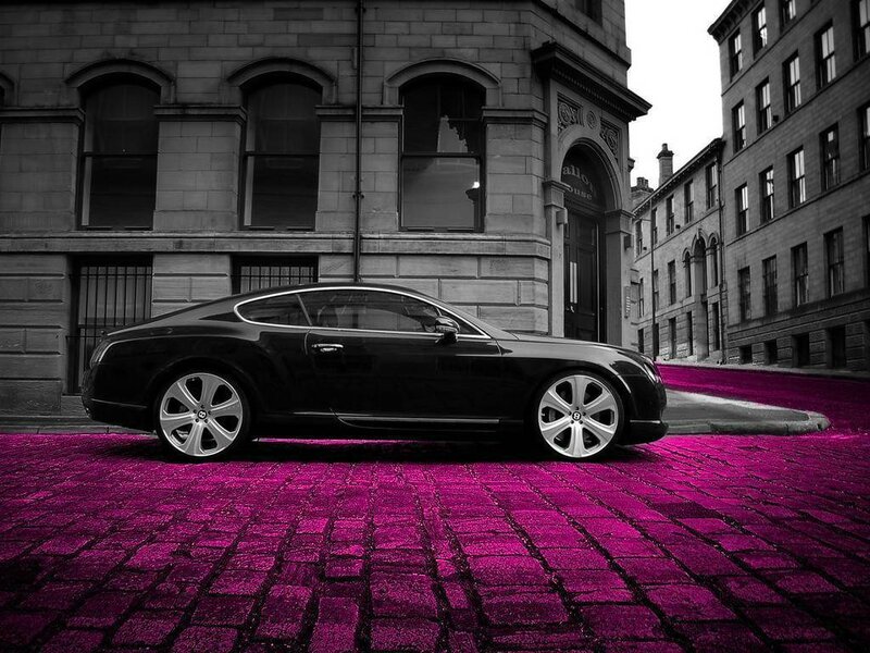 black car on pink street