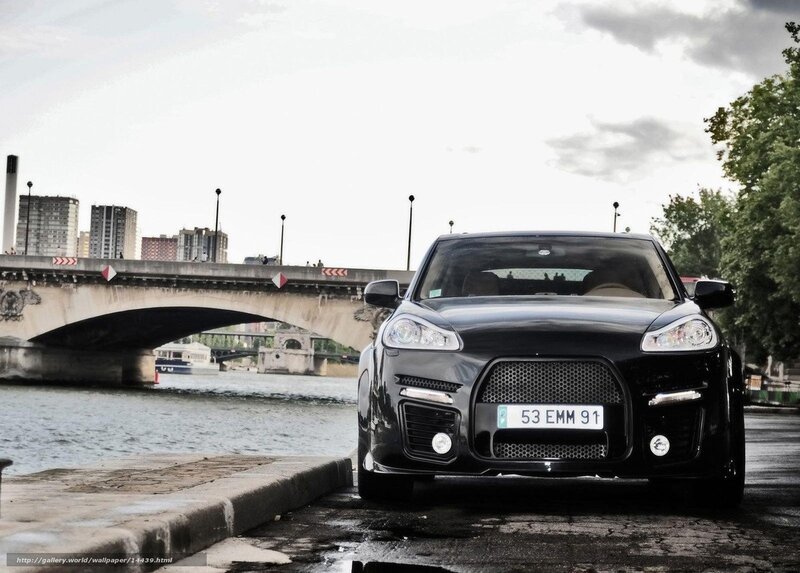 Black car on riverbank